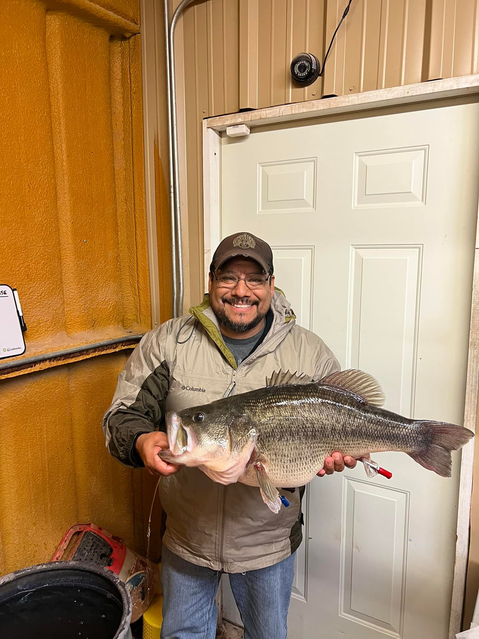 An angler poses with a Texas trophy largemouth bass.