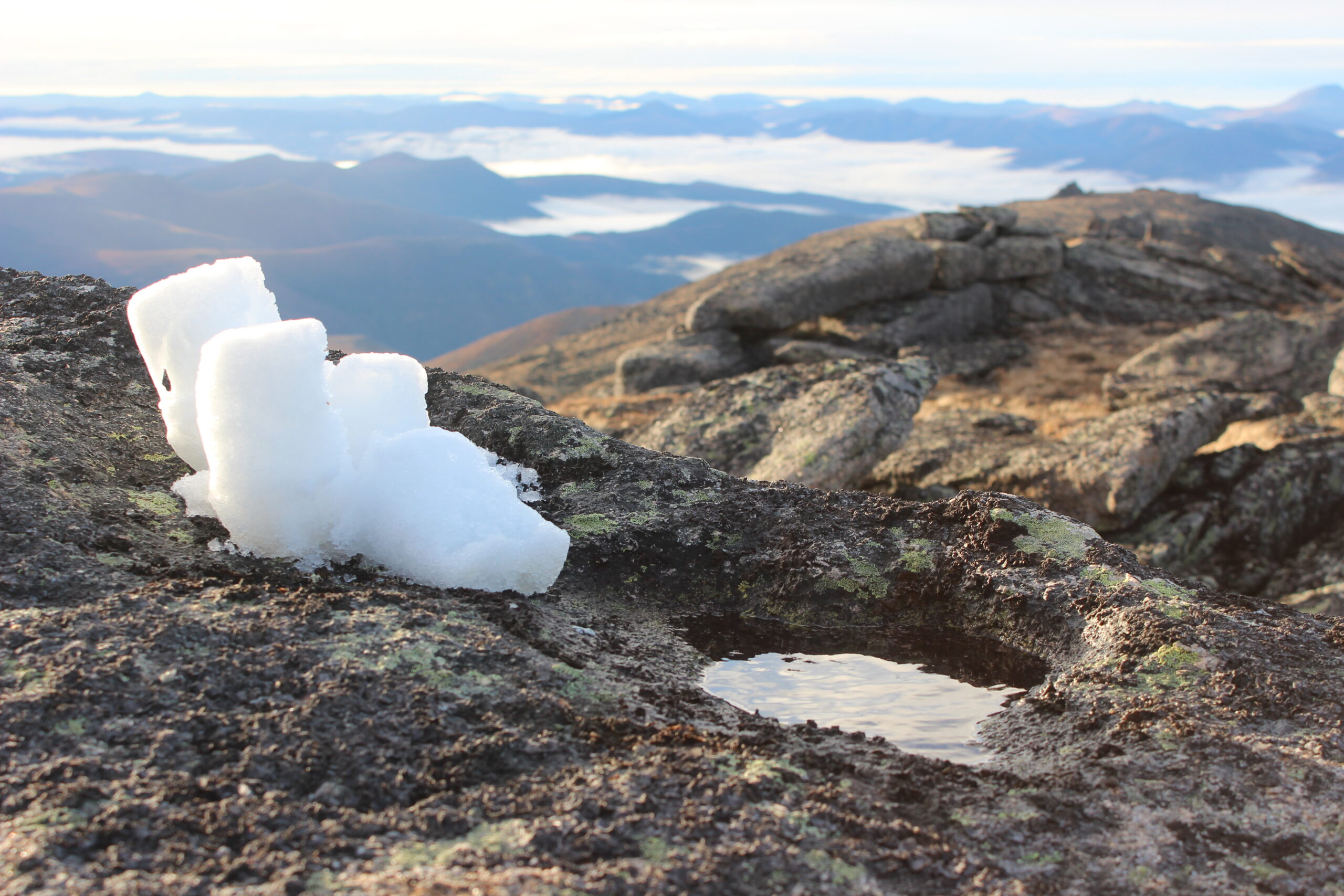 Snow piled on a rock to melt for water