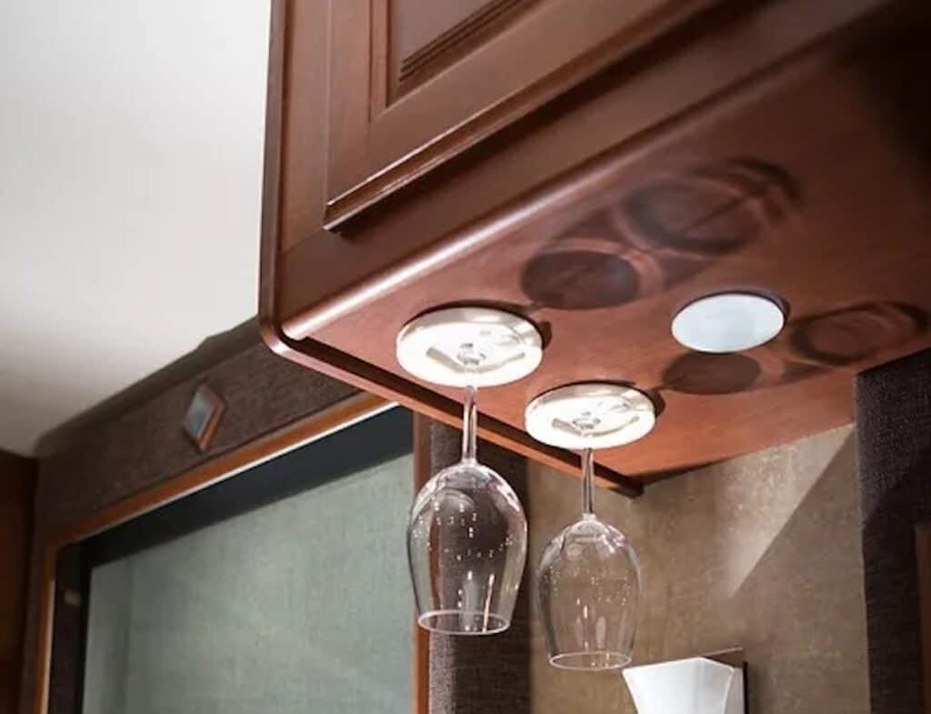 Yoebi wine glass holder mounted on underside of RV cabinet with wine glasses