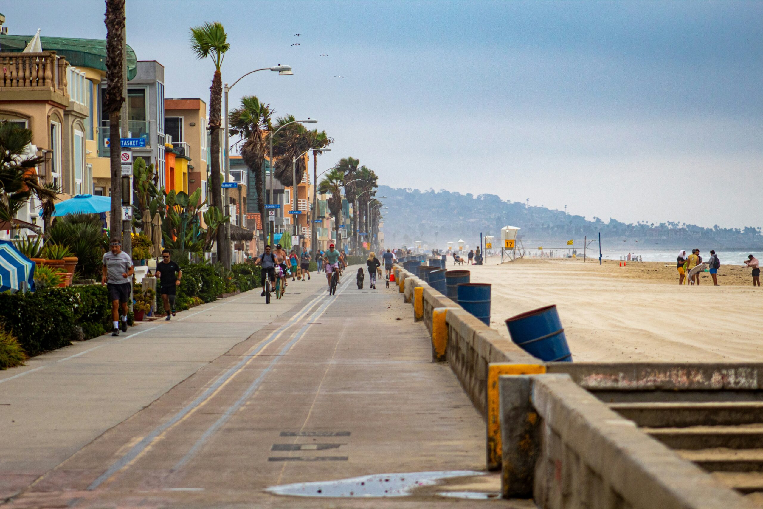 A long boardwalk overlooking a beach.