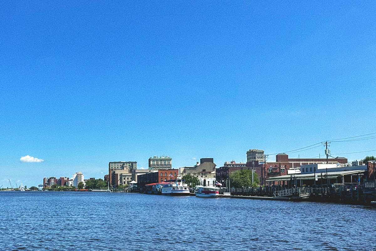 Image of a waterfront that includes some paddleboats.
