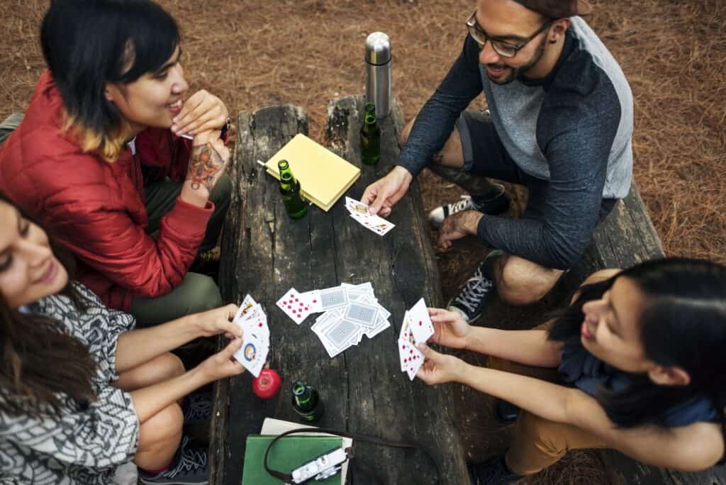 traditional games like cards are fun for camping for both kids and adults