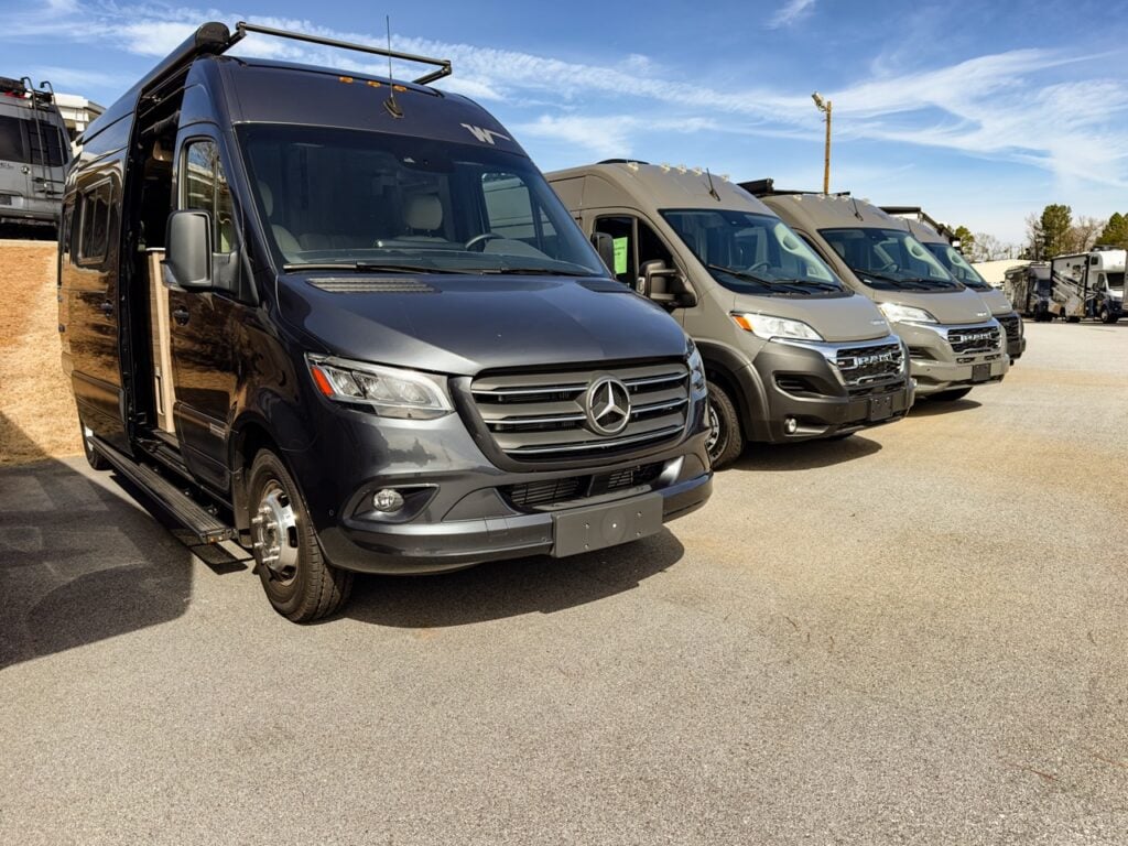 Class B motorhomes in a dealer lot.