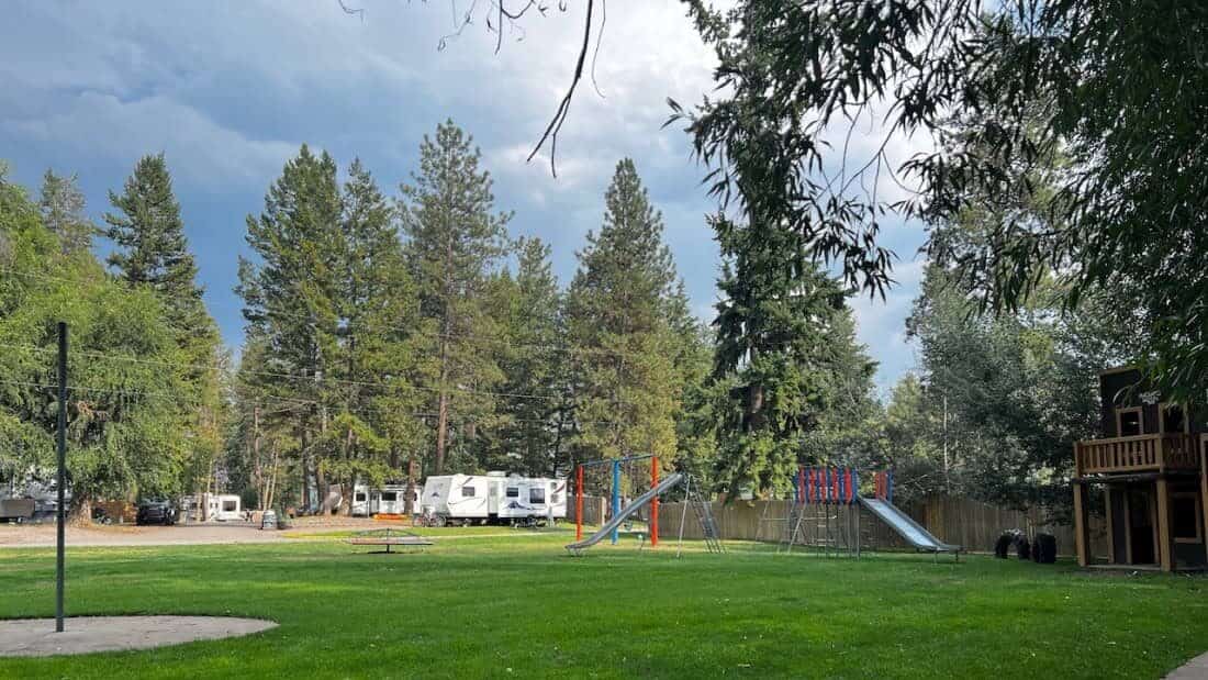 A playground and RV sites at Rocky Mountain "Hi" RV Park & Campground.