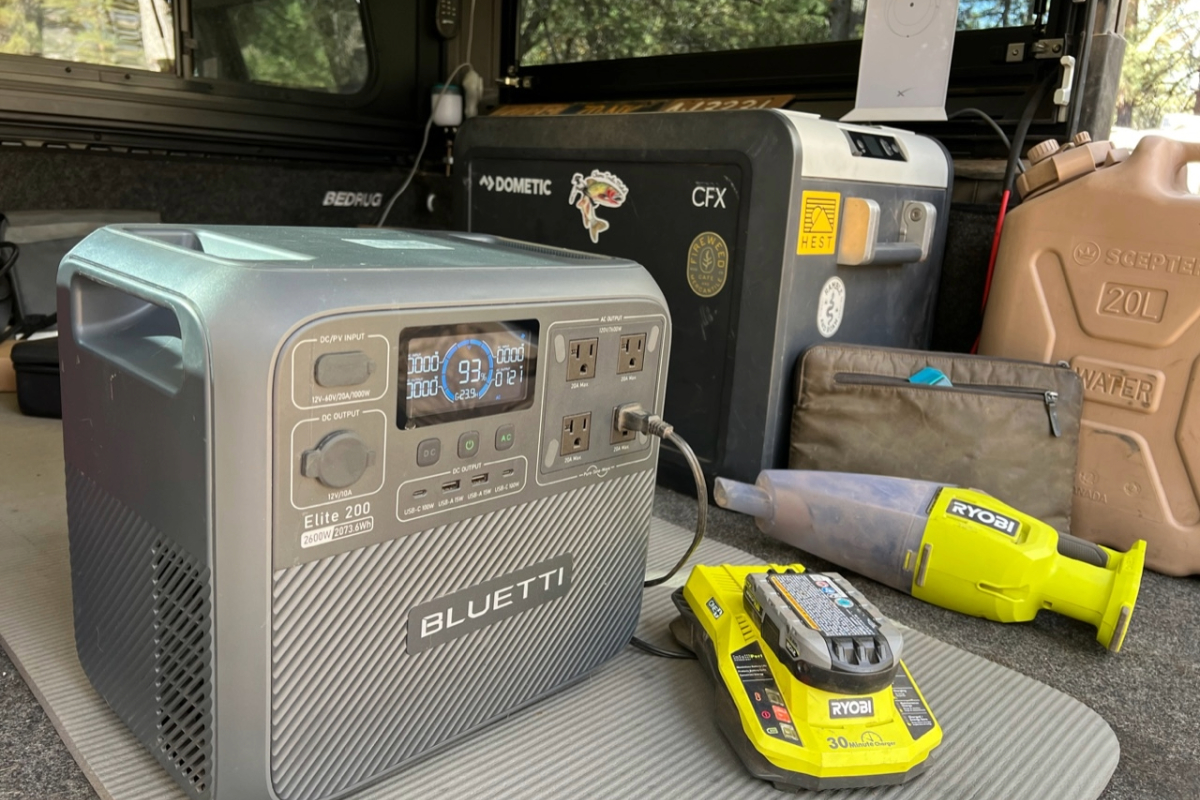portable power station set in back of vehicle with power tool plugged into it
