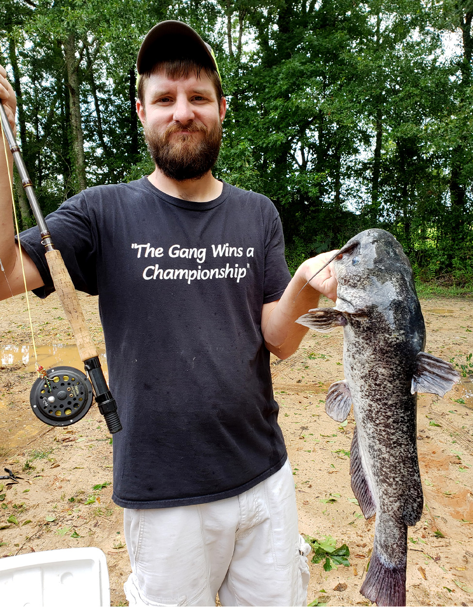 Fly angler with bullhead catfish.