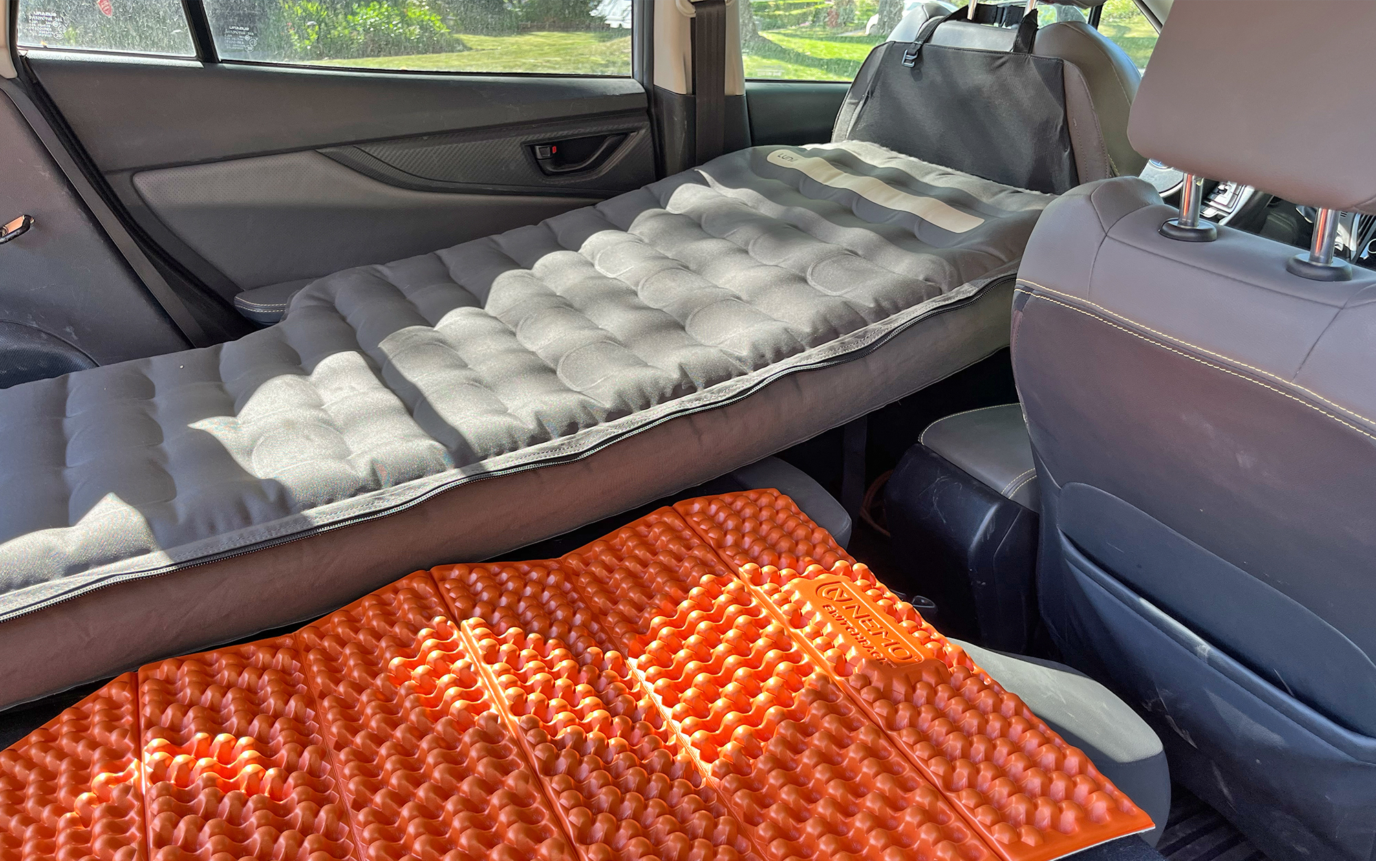 Luno camping mattress for couples sits next to Nemo Switchback.