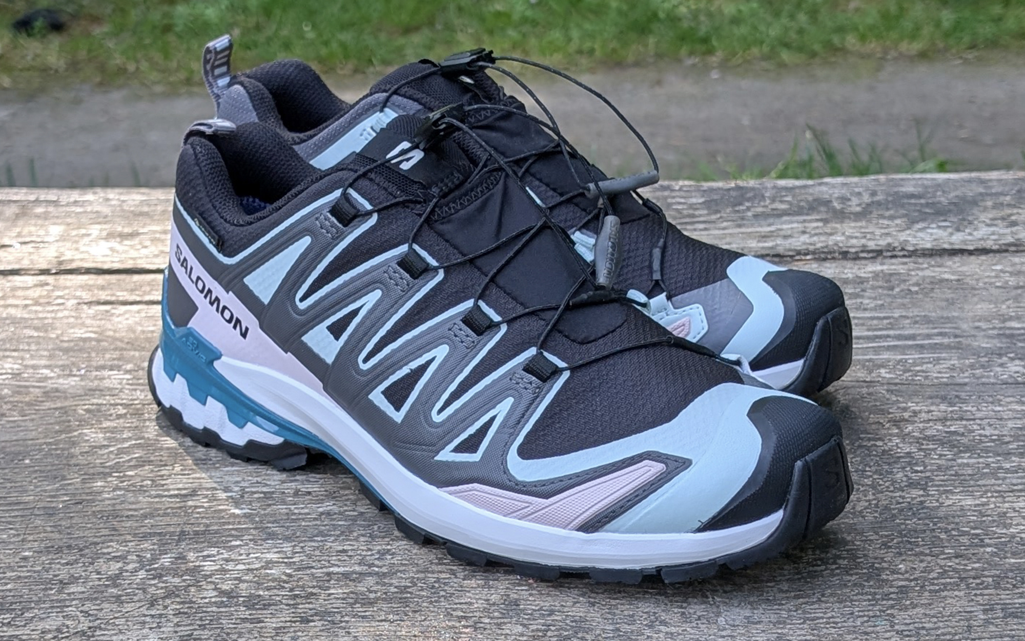 Salomon XA Pro 3D V9 GTX sitting on a wood bench