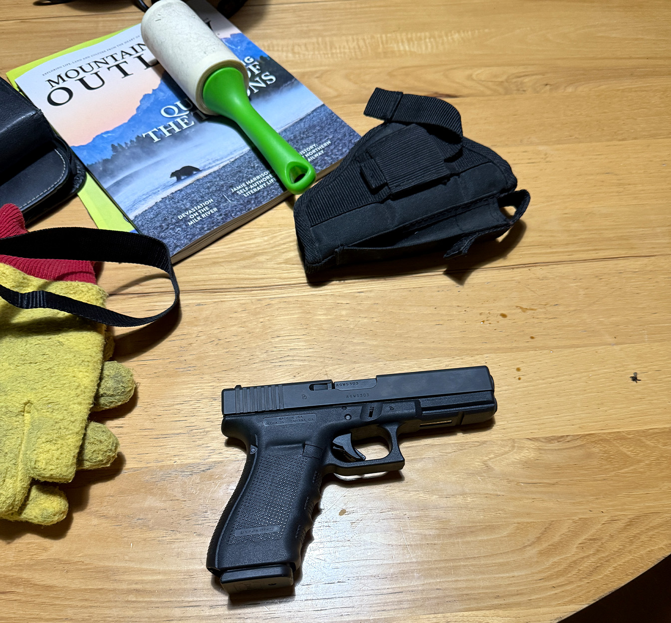 A 10mm Glock handgun on a table.