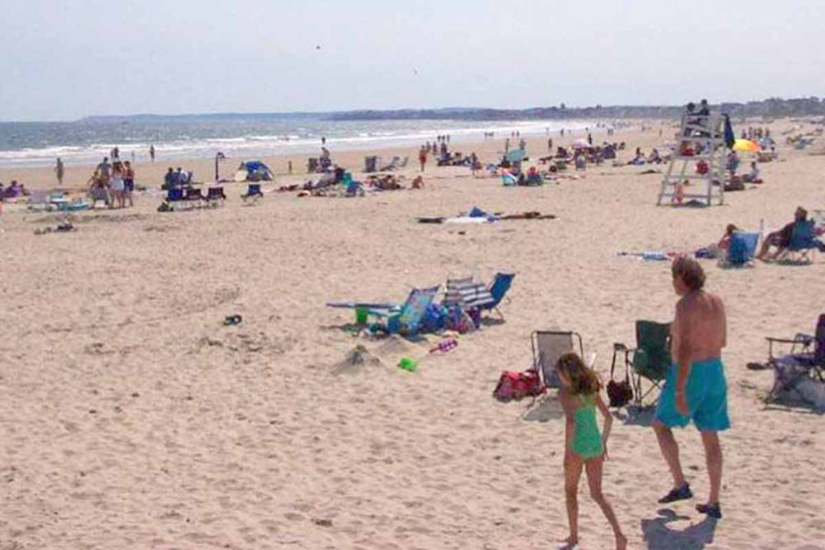 Sun bathers of all ages relax on one of Maine's south coast beaches.