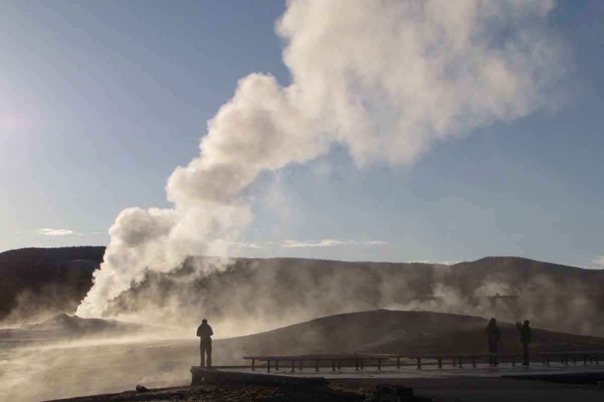Lone individual gazes at a hot spring.