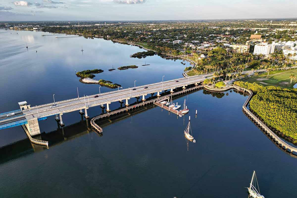 Bridge connected to lush green island.