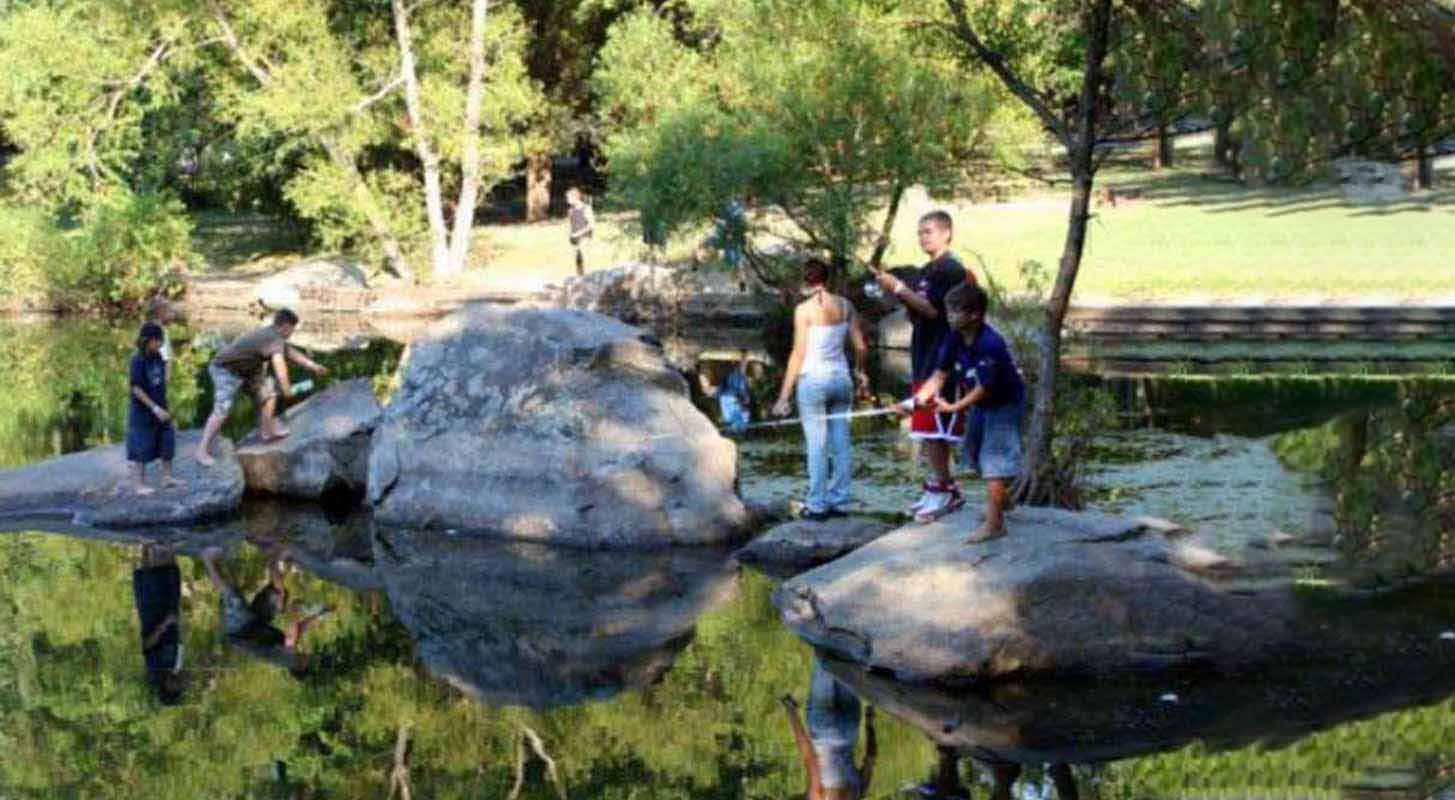 Kids fishing on rocks.