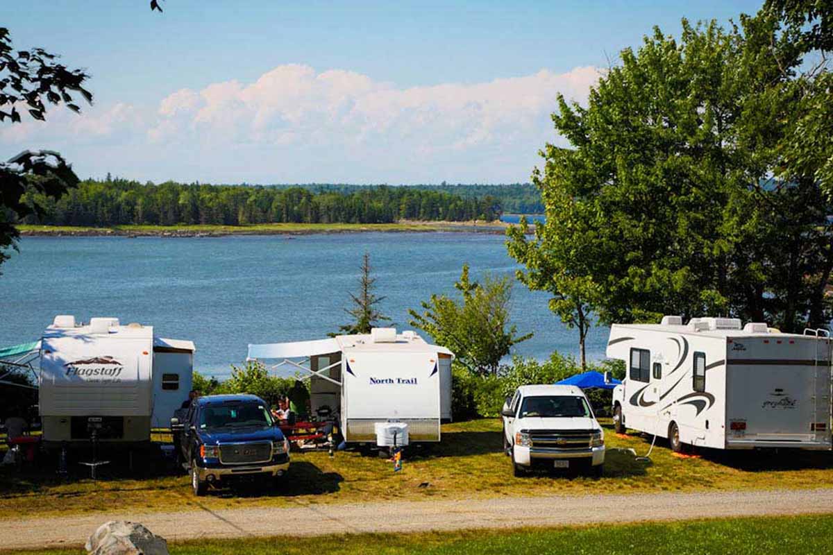 RVs parked along a channel.