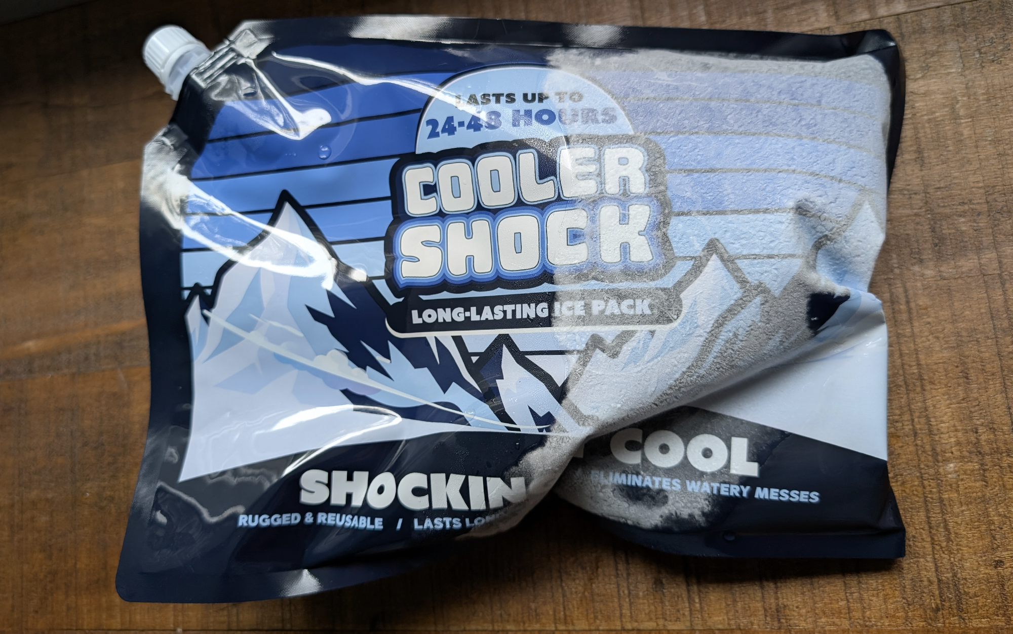 Cooler shock ice pack sitting on a wooden surface