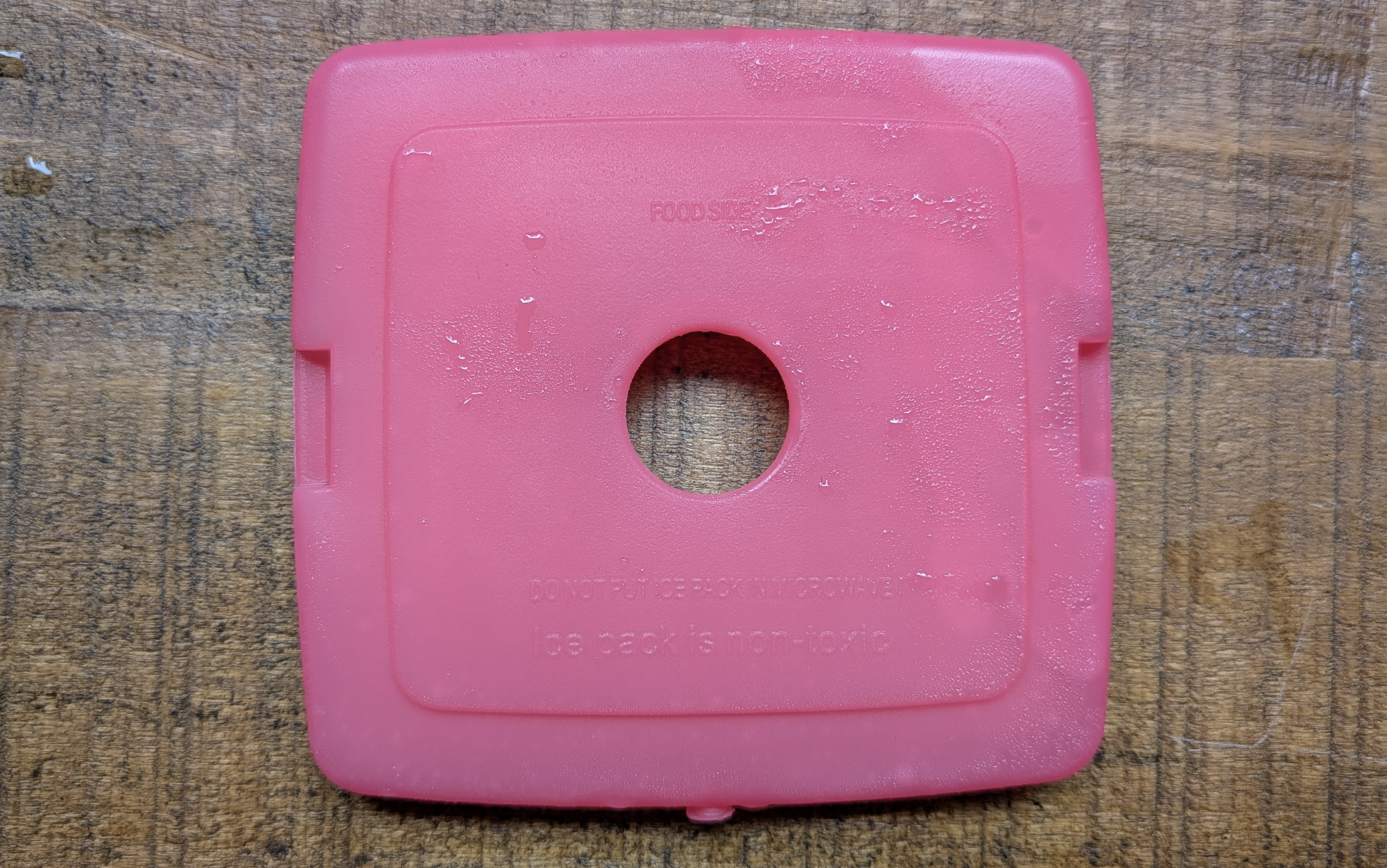  Cool coolers ice pack sitting on a wooden surface