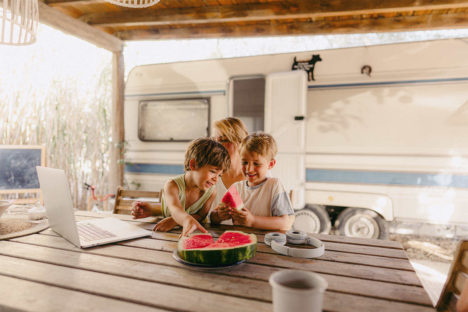 Family on a computer at a camp table