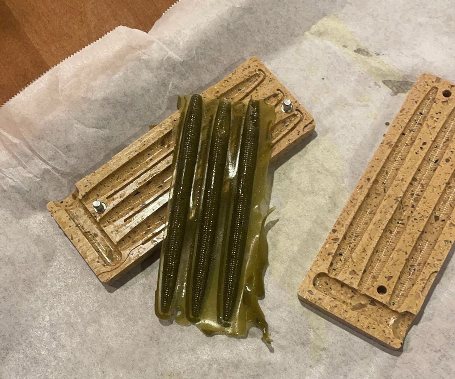 Biodegradable fishing lures in a mold.